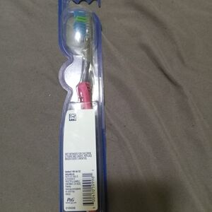 Oral-B Toothbrush with Blue and Green Bristles